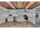 Modern kitchen featuring stainless steel appliances, white cabinetry and hardwood floors at 141 S Broad E St, Angier, NC 27501