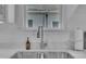 Close up of kitchen sink with stainless steel faucet and quartz countertop at 141 S Broad E St, Angier, NC 27501