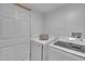 Well-equipped laundry room with modern washer and dryer units at 141 S Broad E St, Angier, NC 27501
