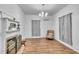 Bright living room featuring a decorative fireplace, wood floors, and natural light at 141 S Broad E St, Angier, NC 27501