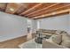Cozy living room boasts a comfortable sectional sofa, modern rug and direct access to the dining area at 141 S Broad E St, Angier, NC 27501
