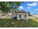 The rear of this home features great yard space and an attached structure at 141 S Broad E St, Angier, NC 27501