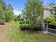 The home features a manicured backyard that can be enjoyed from a screened in porch at 1413 Glenwater Dr, Cary, NC 27519