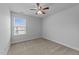 Cozy bedroom with carpet, neutral walls, and a window providing natural light at 1413 Glenwater Dr, Cary, NC 27519