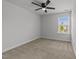 Bedroom with neutral walls, carpet flooring, and a window providing natural light at 1413 Glenwater Dr, Cary, NC 27519
