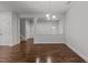 This dining area boasts hardwood floors, a chandelier and an open view to the front door at 1413 Glenwater Dr, Cary, NC 27519