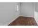Clean and bright entryway with hardwood floors and white trim, leading into the home at 1413 Glenwater Dr, Cary, NC 27519