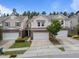 Attractive two-story townhouses featuring brick accents and attached garages in a well-maintained community at 1413 Glenwater Dr, Cary, NC 27519