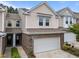 Lovely two-story townhouse with a brick front and a convenient two-car attached garage at 1413 Glenwater Dr, Cary, NC 27519