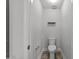 Powder room featuring neutral walls and a toilet with storage space at 1413 Glenwater Dr, Cary, NC 27519