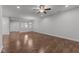 The spacious living room has hardwood floors and views through the dining area to the entry at 1413 Glenwater Dr, Cary, NC 27519