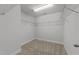 Spacious walk-in closet featuring carpet flooring and ample storage with multiple wire rack shelves at 1413 Glenwater Dr, Cary, NC 27519