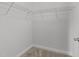 Bright walk-in closet featuring carpet flooring and wire shelving at 1413 Glenwater Dr, Cary, NC 27519