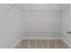 Walk-in closet featuring carpet flooring and wire shelving for storage and organization at 1413 Glenwater Dr, Cary, NC 27519