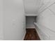Walk-in closet with wood flooring and white, wire shelving at 1413 Glenwater Dr, Cary, NC 27519