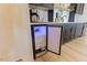 Built-in bar area with an ice maker and black cabinetry, perfect for entertaining at 15 Magnolia Ln, Youngsville, NC 27596