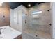 Modern bathroom showcasing a glass-enclosed shower and dual showerheads at 15 Magnolia Ln, Youngsville, NC 27596