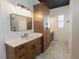 Bathroom featuring custom wood cabinetry and a modern design with ample storage at 15 Magnolia Ln, Youngsville, NC 27596