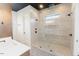 Modern bathroom showcasing a glass-enclosed shower and dual showerheads at 15 Magnolia Ln, Youngsville, NC 27596
