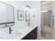 Stylish bathroom with double sinks, quartz countertops, sleek fixtures, and modern decor at 15 Magnolia Ln, Youngsville, NC 27596