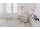 Bright Bedroom with a cozy armchair, stylish decor, and plenty of natural light at 15 Magnolia Ln, Youngsville, NC 27596