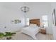 Bright bedroom with wood accent wall and chandelier at 15 Magnolia Ln, Youngsville, NC 27596