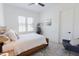 Serene bedroom with a well-lit window, a bed, a chair, and modern decor at 15 Magnolia Ln, Youngsville, NC 27596