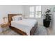 Serene bedroom with a well-lit window, a bed, and modern decor at 15 Magnolia Ln, Youngsville, NC 27596