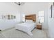 Bright bedroom with wood accent wall and chandelier at 15 Magnolia Ln, Youngsville, NC 27596