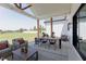 Stylish covered patio with outdoor dining and seating, ideal for entertaining at 15 Magnolia Ln, Youngsville, NC 27596