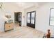 Bright foyer with hardwood floors, modern lighting, and stylish decor at 15 Magnolia Ln, Youngsville, NC 27596
