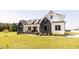 Beautifully landscaped two-story home with a modern, eye-catching exterior design at 15 Magnolia Ln, Youngsville, NC 27596