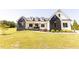 Stunning two-story home featuring a modern design and well-maintained landscaping at 15 Magnolia Ln, Youngsville, NC 27596