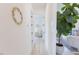 Bright hallway with decorative wreath and views into other rooms at 15 Magnolia Ln, Youngsville, NC 27596