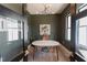 Inviting home office with large windows, modern light fixture and decorative touches at 15 Magnolia Ln, Youngsville, NC 27596