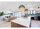 Open concept living space features the kitchen, island, dining area and living room with a fireplace at 15 Magnolia Ln, Youngsville, NC 27596