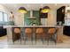 Kitchen island with seating features a white countertop, wood base, and stylish pendant lighting above at 15 Magnolia Ln, Youngsville, NC 27596