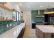Open kitchen with stainless steel appliances, white countertops, and a functional layout at 15 Magnolia Ln, Youngsville, NC 27596