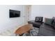 Comfortable living room featuring a sectional sofa, TV, and a wood coffee table at 15 Magnolia Ln, Youngsville, NC 27596