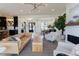 Open-concept living room showcasing the kitchen, dining area, fireplace, and stylish furniture at 15 Magnolia Ln, Youngsville, NC 27596