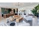 Open-concept living room with modern decor, stylish furniture, and a view of the kitchen and dining area at 15 Magnolia Ln, Youngsville, NC 27596