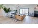 Bright living room with an open floor plan, fireplace, and sliding doors to outdoor space at 15 Magnolia Ln, Youngsville, NC 27596