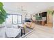 Spacious living room with an open-concept design that flows into a kitchen with an island at 15 Magnolia Ln, Youngsville, NC 27596