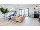 Comfortable living room with a fireplace and a view of the backyard through sliding glass doors at 15 Magnolia Ln, Youngsville, NC 27596
