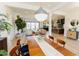 Open living space with dining and kitchen visible, bright with natural light, open design at 15 Magnolia Ln, Youngsville, NC 27596