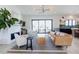 Bright living room with a modern fireplace and large sliding glass doors to the outside at 15 Magnolia Ln, Youngsville, NC 27596