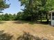Expansive backyard featuring a large, grassy area with mature trees and landscaping at 1612 Bethlehem Rd, Knightdale, NC 27545