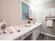 Bathroom featuring a long vanity with ample counter space, and neutral decor at 1612 Bethlehem Rd, Knightdale, NC 27545