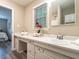 Bright bathroom featuring a long vanity with drawers, neutral decor, and modern fixtures at 1612 Bethlehem Rd, Knightdale, NC 27545