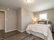 Cozy bedroom with a comfortable bed, soft neutral colors, and natural light at 1612 Bethlehem Rd, Knightdale, NC 27545